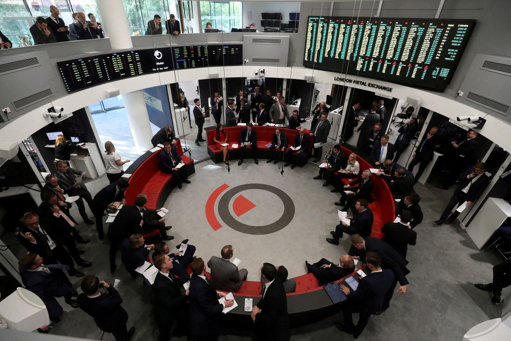 Traders work on the floor of the London Metal Exchange, in London, Britain September 27, 2018. REUTERS/Simon Dawson