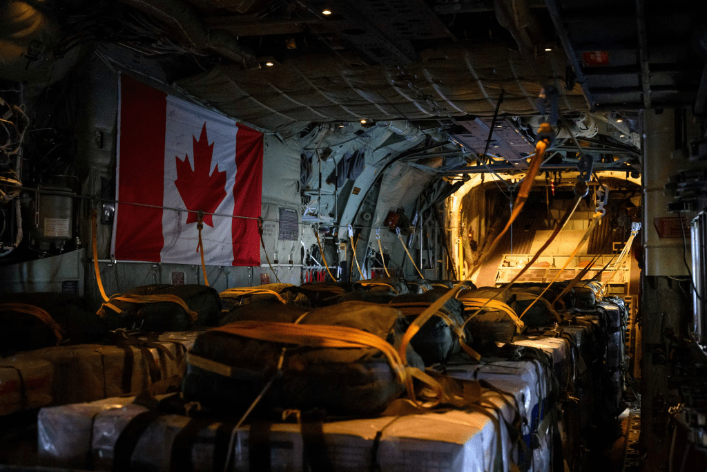Pallets are prepared on a Royal Canadian Air Force CC-130 Hercules transport aircraft before airdropping some of approximately 21,600 lbs of humanitarian aid over the Gaza Strip, at Queen Alia International Airport in Amman, Jordan August 4, 2025. Corporal Marc-Andre Leclerc/Canadian Forces/Handout via REUTERS