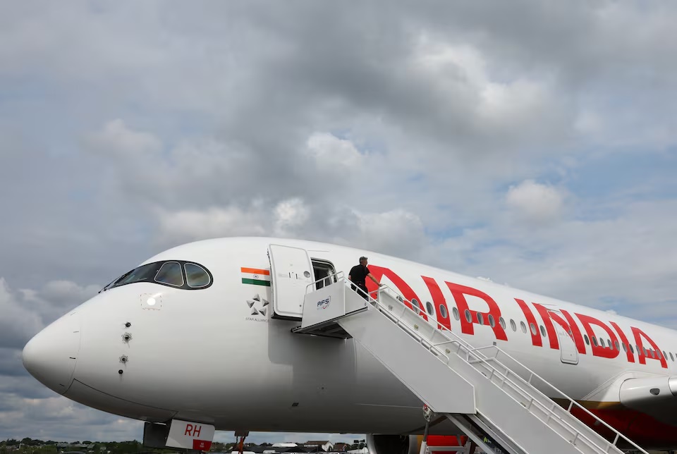 Branding for Air India is seen on an Airbus A350-900 at the Farnborough International Airshow, in Farnborough, Britain, July 24, 2024. REUTERS/Toby Melville