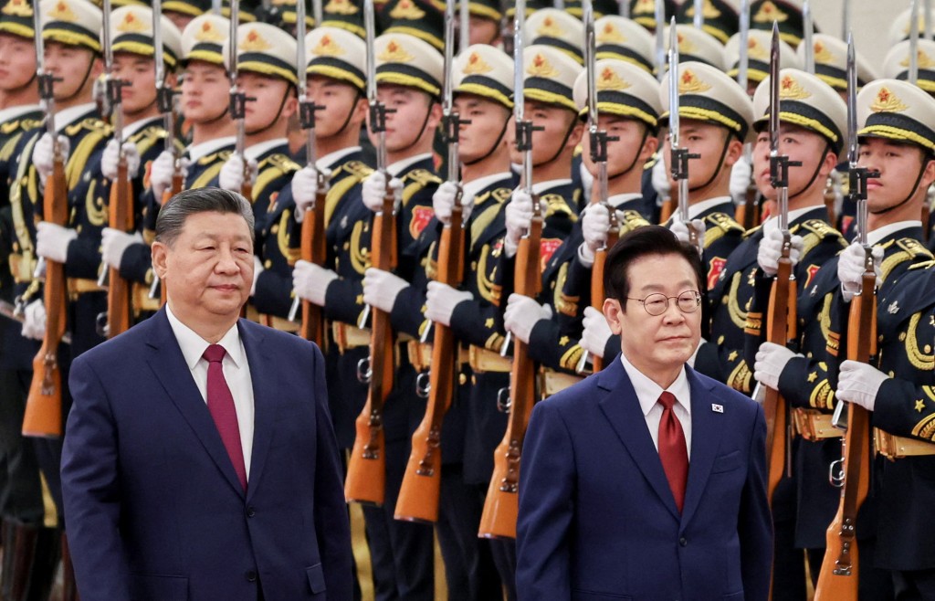Chinese President Xi Jinping and South Korean President Lee Jae Myung inspect honor guards during a welcome ceremony at the Great Hall of the People in Beijing, China, January 5, 2026. (Reuters)