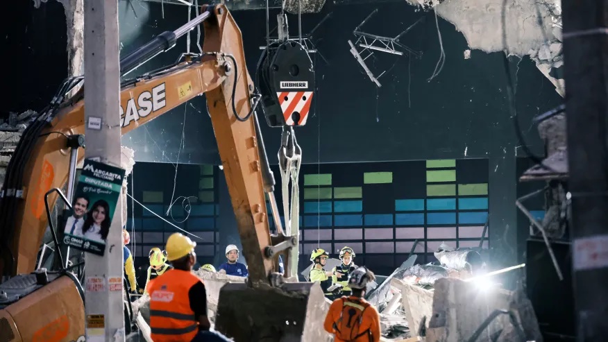 Rescue workers search for survivors at the Jet Set nightclub after its roof collapsed two nights before during a merengue concert in Santo Domingo, Dominican Republic, Wednesday, April 9, 2025. (AP Photo/Ricardo Hernandez)