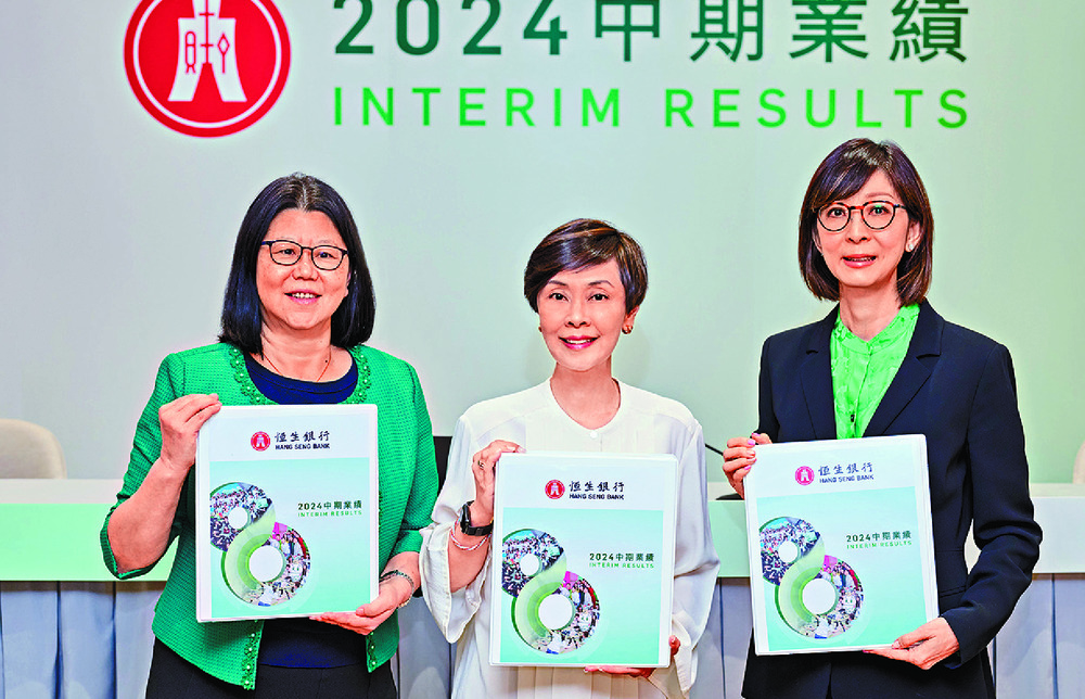 Announcing the results are, from left, Saw Say Pin, Diana Cesar and chief compliance officer Kathy Cheung. Announcing the results are, from left, Saw Say Pin, Diana Cesar and chief compliance officer Kathy Cheung.