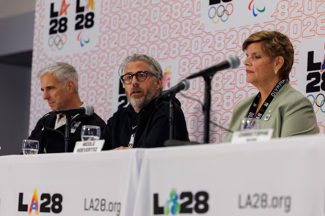 Casey Wasserman, LA28 Chairperson and President speaks between Nicole Hoevertsz, IOC Vice President and LA28 Coordination Commission Chair, and Reynold Hoover, LA28 Chief Executive Officer, during a press conference in Los Angeles, California, U.S. June 5, 2025. REUTERS/Mike Blake 