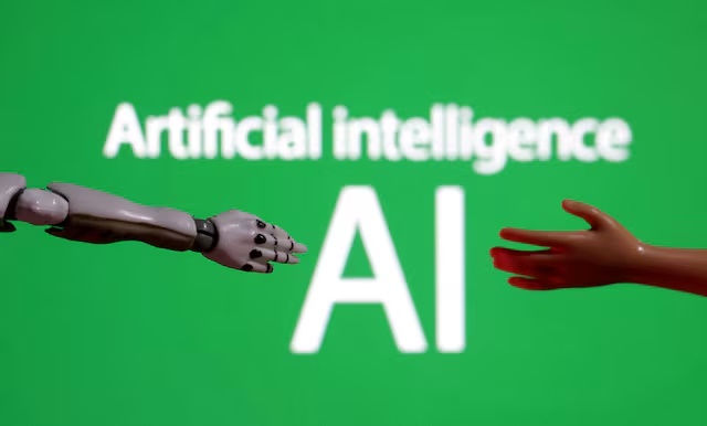 Words reading "Artificial intelligence AI", miniature of robot and toy hand are pictured in this illustration taken December 14, 2023. REUTERS/Dado Ruvic/Illustration/File Photo 