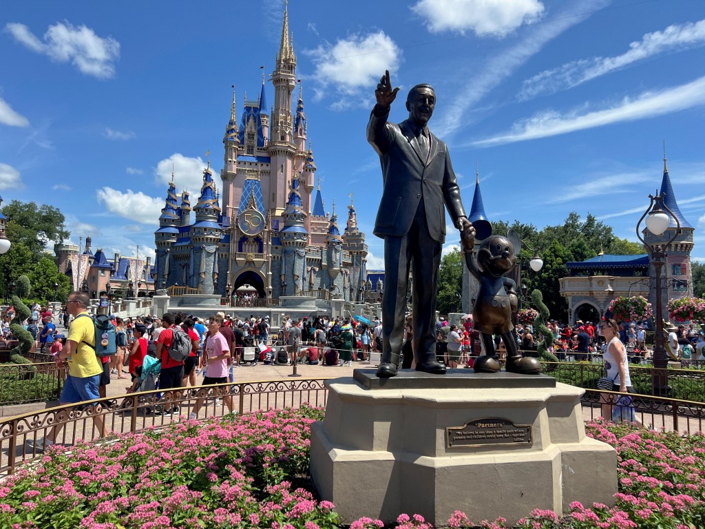 People gather at the Magic Kingdom theme park before the "Festival of Fantasy" parade at Walt Disney World in Orlando, Florida, U.S. July 30, 2022.  REUTERS