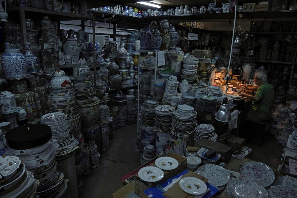 A staff member works at the Yuet Tung China Works. (AP) A staff member works at the Yuet Tung China Works. (AP)