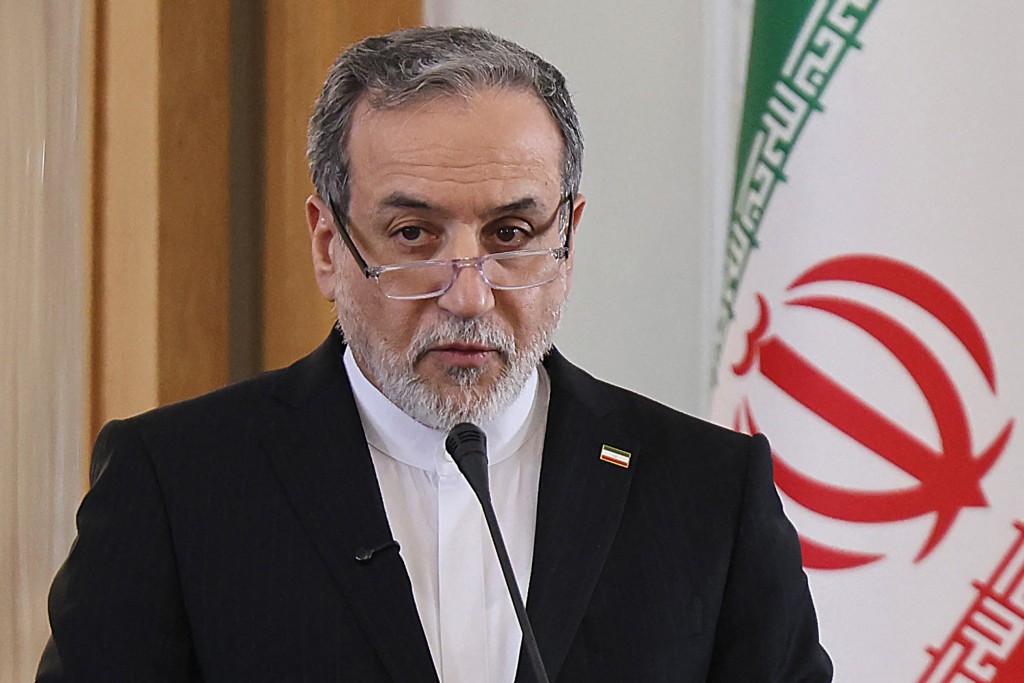 Photo by ATTA KENARE / AFP  Iranian Foreign Minister Abbas Araghchi attends a joint press conference with his Iraqi counterpart Fuad Hussein in Tehran on January 18, 2026.