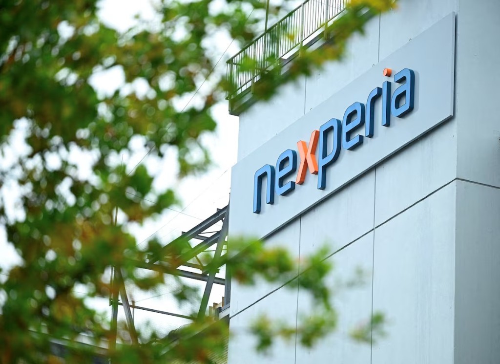 The logo of Chinese-owned semiconductor company Nexperia is displayed at the chipmaker's German facility, after the Dutch government seized control and auto industry bodies sounded the alarm over the possible impact on car production, in Hamburg, Germany, October 23, 2025. REUTERS