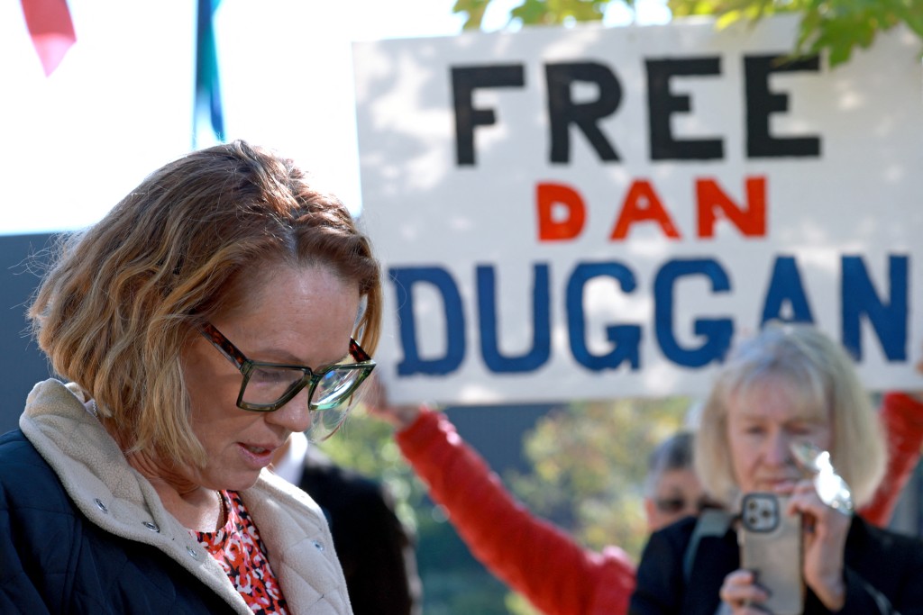 Photo by DAVID GRAY / AFP  Saffrine Duggan (L), the wife of Daniel Duggan, talks to the media outside the Federal Court of Australia in Canberra on April 16, 2026.