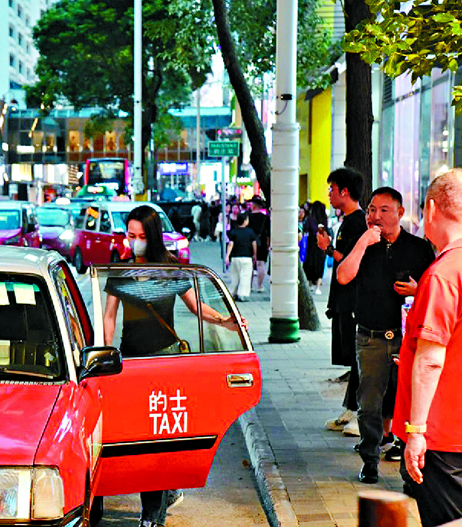 A woman with a face mask opens the door of a red taxi, while several pedestrians are visible on a lively city street with colorful buildings and vehicles, reflecting the context of Hong Kong ride-hailing regulation 2025.
