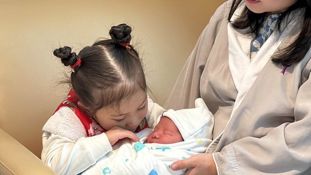 The older sister and the baby Miles. 