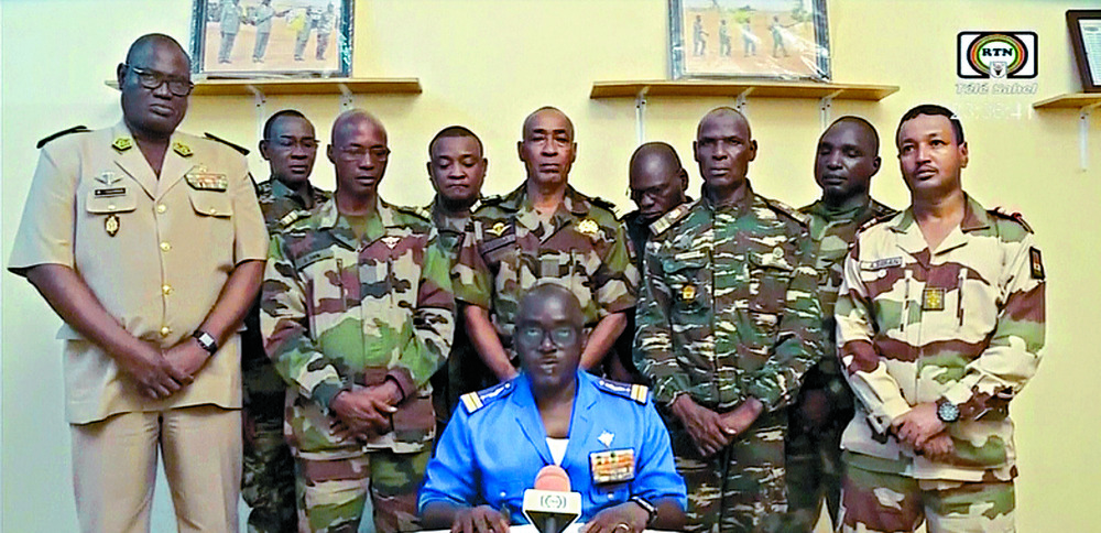 Niger soldiers announce the coup and president's removal on national TV. AP Niger soldiers announce the coup and president's removal on national TV. AP