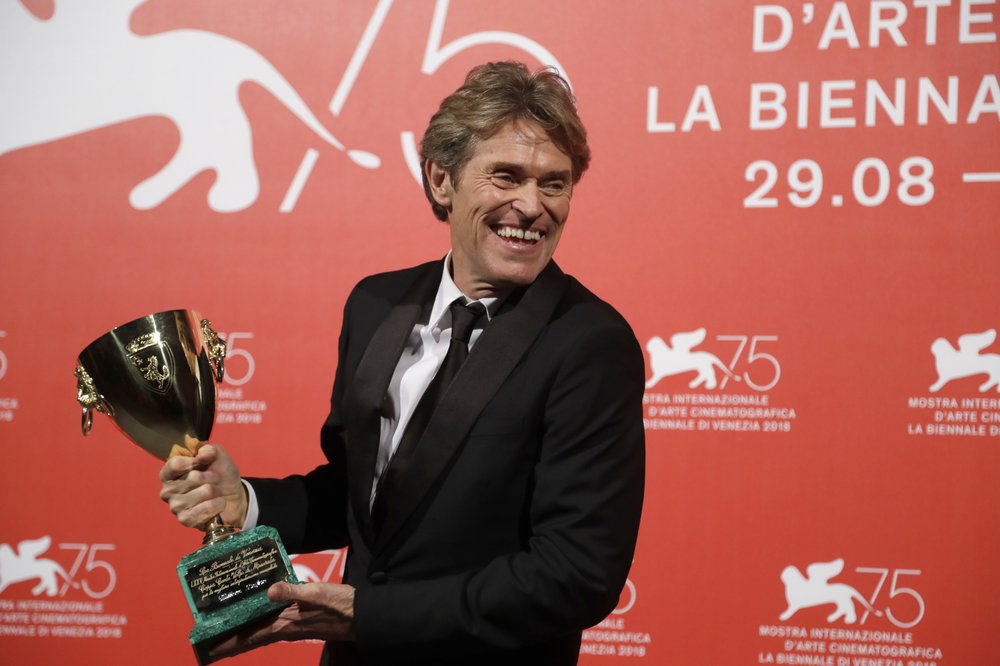 Actor Willem Dafoe holds the Coppa Volpi Best Actor award for 'At Eternity's Gate' at the Venice Film Festival.