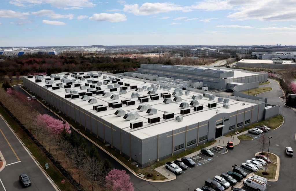 A car drives past a building of the Digital Realty Data Center in Ashburn, Virginia, U.S., March 17, 2025. REUTERS/Leah Millis 