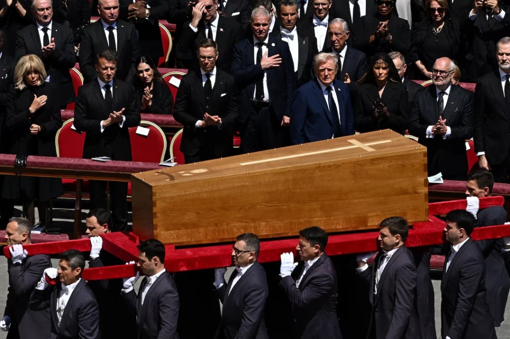 U.S. President Donald Trump, first lady Melania Trump, France's President Emmanuel Macron and his wife Brigitte Macron stand as the coffin is carried on the day of the funeral of Pope Francis in St. Peter's Square at the Vatican, April 26, 2025. (Reuters)