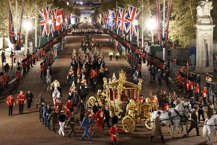 The Gold State Coach is ridden alongside members of the military during a full overnight dress rehearsal of the Coronation Ceremony of Britain’s King Charles and Camilla, Queen Consort in London, Britain. (Reuters) The Gold State Coach is ridden alongside members of the military during a full overnight dress rehearsal of the Coronation Ceremony of Britain’s King Charles and Camilla, Queen Consort in London, Britain. (Reuters)