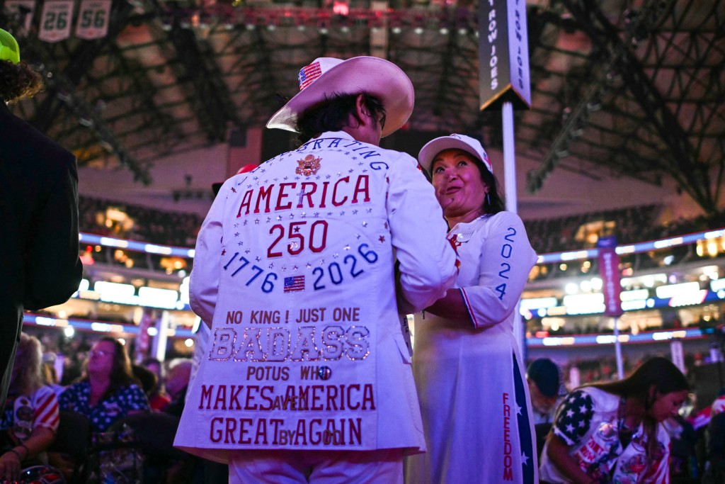 Photo by KENT NISHIMURA / AFP  Attendees speak with each other during the Republican National Midterm Convention at the American Airlines Center in Dallas, Texas on September 9, 2026.