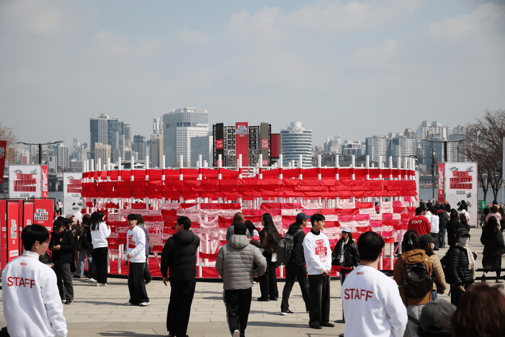 Fans of Kpop group BTS share a moment during an event 'Love Song Lounge' to promote their new album Arirang before 'BTS The Comeback Live Arirang' concert in central Seoul, South Korea, March 20, 2026. REUTERS/Kim Hong-Ji 