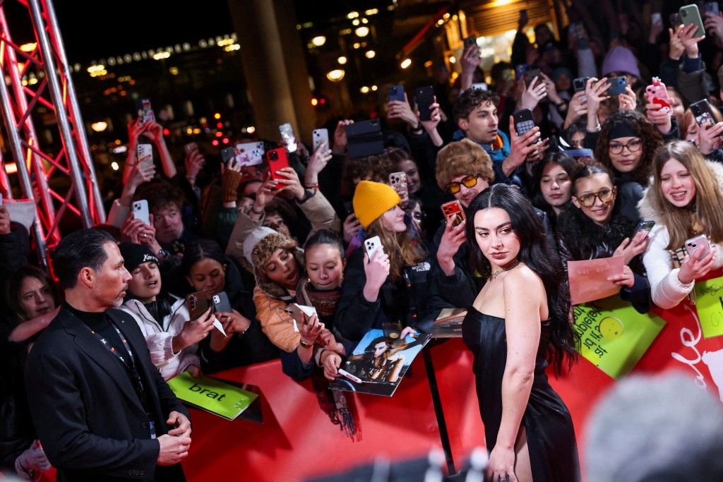 Charli xcx poses on the red carpet for the premiere of the mockumentary 'The Moment' at the 76th Berlinale International Film Festival in Berlin, Germany February 14, 2026. (Reuters)