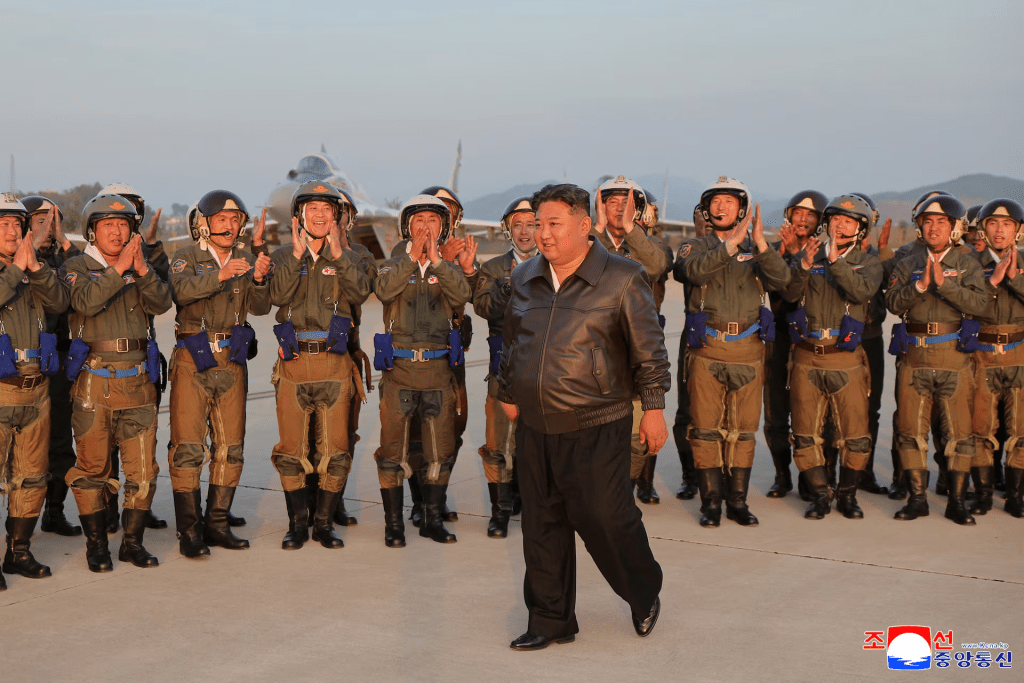 North Korean leader Kim Jong Un is cheered by military pilots during a visit to an airfield in this photo released by the Korean Central News Agency, May 16, 2025. KCNA via REUTERS