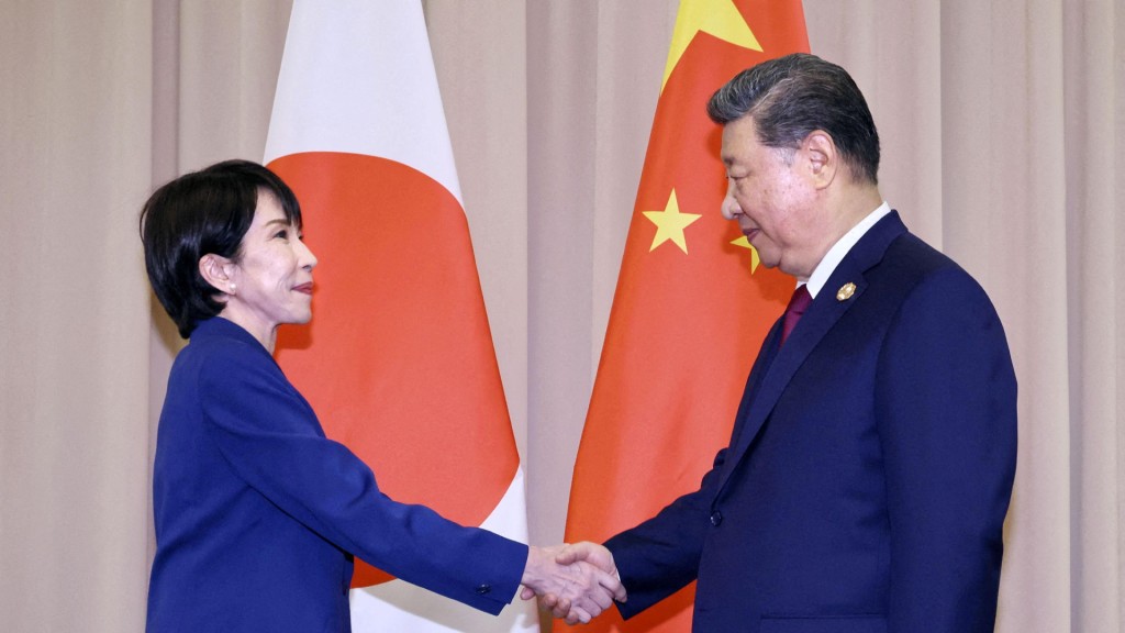 Japanese Prime Minister Sanae Takaichi shakes hands with Chinese President Xi Jinping ahead of their talks in Gyeongju, South Korea, October 31, 2025. Kyodo/via REUTERS/File Photo