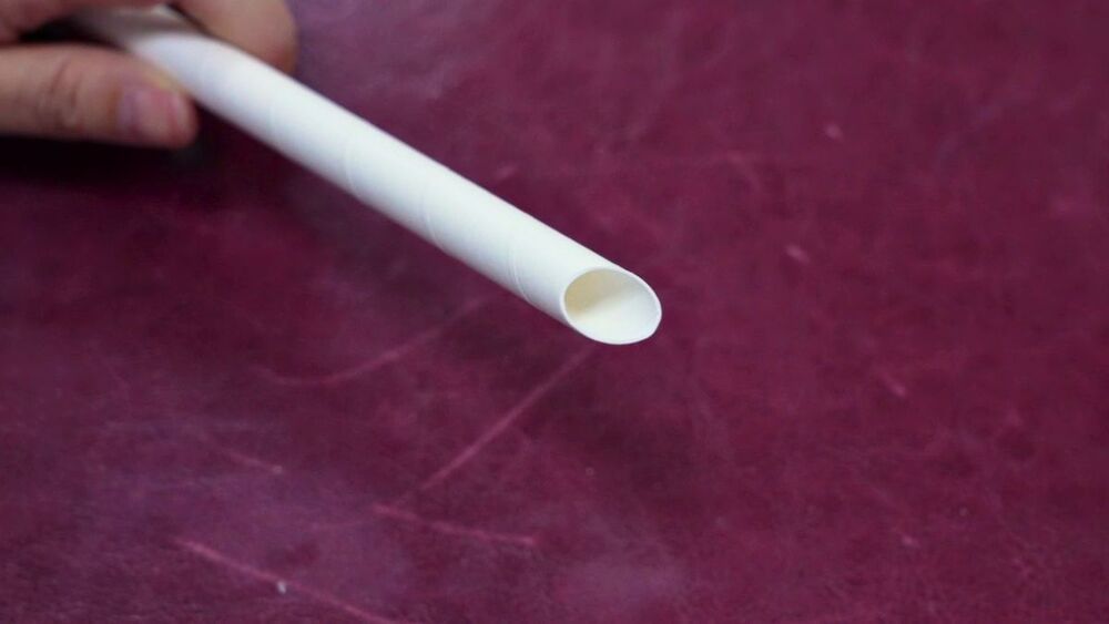 A nature-friendly straw. The first phase of the ban from April 22 involves takeaway food, but it shouldn't hurt people's wallets, says Calvin So, far right, seen with his father Parry.SING TAO