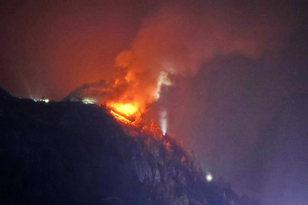 Photo by FERDINAND DÖRFLER-FARTHOFER / 7AKTUELL / AFP  The Kehlsteinhaus, known as the Eagle's Nest, formerly Adolf Hitler's mountain retreat, is engulfed in flames on late October 23, 2026, after a large fire had broken out at the site located at an altitude of 1,834 metres (6,000 feet) in the mountains over Berchtesgaden, in the southern German state of Bavaria.