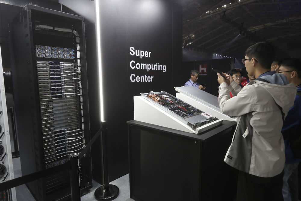 People take photos with NVIDIA GB200 NVL72 AI server during the Hon Hai Tech Day at the Nangang Exhibition Center in Taipei, Taiwan, Tuesday, Oct. 8, 2024 as Foxconn showcases its latest electric car and other technology products. AP People take photos with NVIDIA GB200 NVL72 AI server during the Hon Hai Tech Day at the Nangang Exhibition Center in Taipei, Taiwan, Tuesday, Oct. 8, 2024 as Foxconn showcases its latest electric car and other technology products. AP