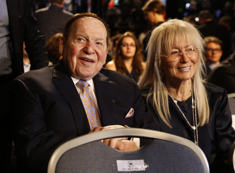 In this September 26, 2016 file photo, Chief Executive of Las Vegas Sands Corporation Sheldon Adelson sits with his wife Miriam waits for the presidential debate between Democratic presidential nominee Hillary Clinton and Republican presidential nominee Donald Trump at Hofstra University in Hempstead, New York. In this September 26, 2016 file photo, Chief Executive of Las Vegas Sands Corporation Sheldon Adelson sits with his wife Miriam waits for the presidential debate between Democratic presidential nominee Hillary Clinton and Republican presidential nominee Donald Trump at Hofstra University in Hempstead, New York.