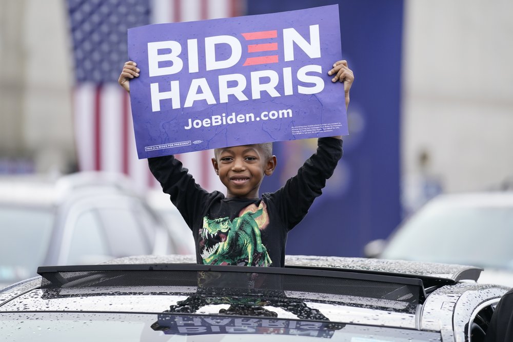 Supporters attend a 'Souls to the Polls' drive-in rally for Democratic presidential candidate former Vice President Joe Biden, at Sharon Baptist Church, Sunday, Nov. 1, 2020 in Philadelphia. Supporters attend a 'Souls to the Polls' drive-in rally for Democratic presidential candidate former Vice President Joe Biden, at Sharon Baptist Church, Sunday, Nov. 1, 2020 in Philadelphia.