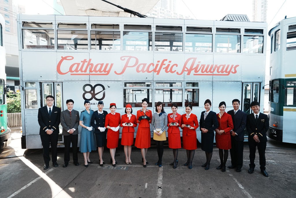 Cathay Chief Customer and Commercial Officer Lavinia Lau Hoi-zee and crew members dressed in vintage uniforms