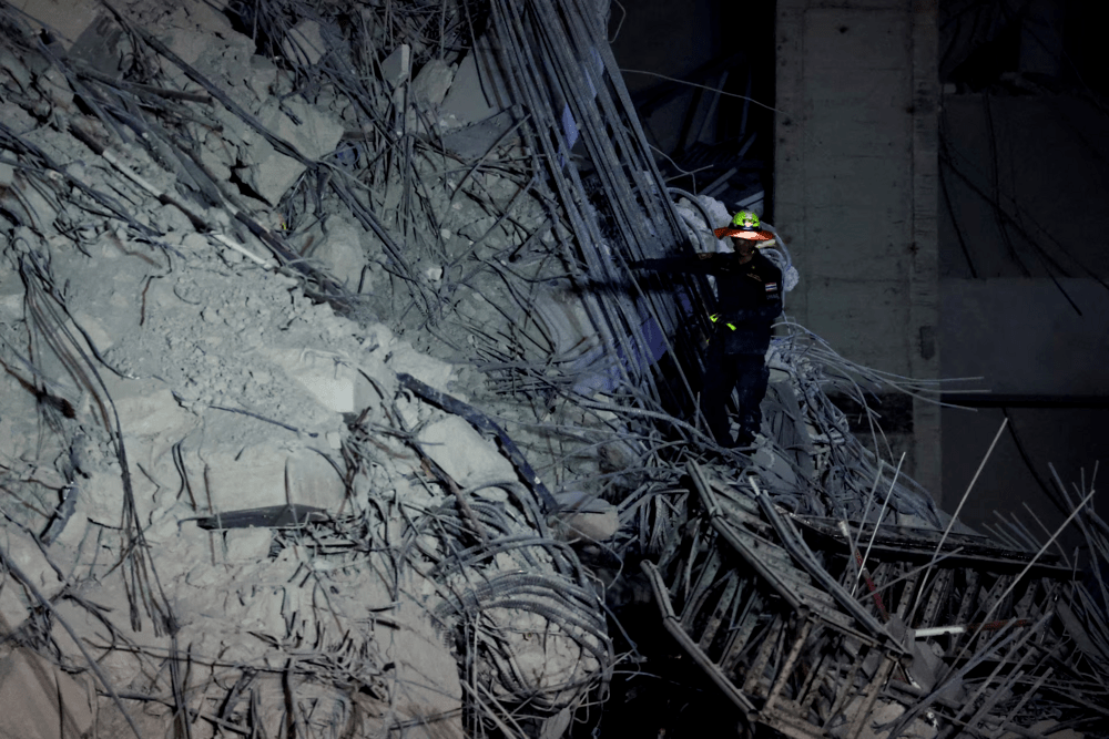 A rescue personnel searches for casualties at the site of a building that collapsed after a strong earthquake struck central Myanmar on Friday, earthquake monitoring services said, which affected Bangkok as well with people pouring out of buildings in the Thai capital in panic after the tremors, in Bangkok, Thailand, March 28, 2025. REUTERS/Athit Perawongmetha A rescue personnel searches for casualties at the site of a building that collapsed after a strong earthquake struck central Myanmar on Friday, earthquake monitoring services said, which affected Bangkok as well with people pouring out of buildings in the Thai capital in panic after the tremors, in Bangkok, Thailand, March 28, 2025. REUTERS/Athit Perawongmetha