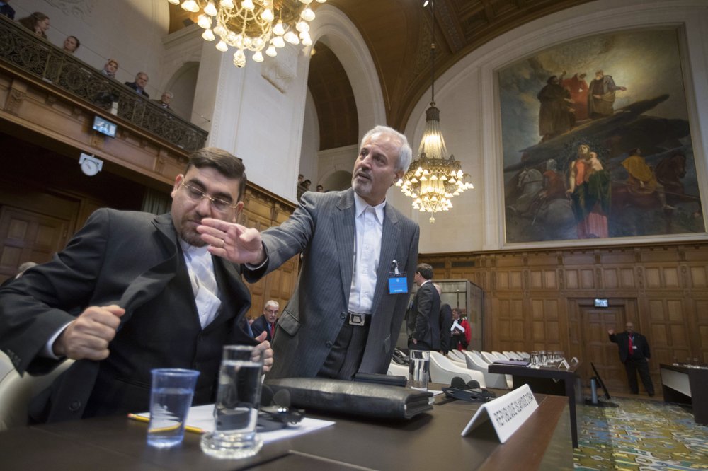 In this Wednesday, October 3, 2018, file photo, Mohammed Zahedin Labbaf, center, agent for the Islamic Republic of Iran, waits for judges to enter the International Court of Justice, or World Court, in The Hague, Netherlands. In this Wednesday, October 3, 2018, file photo, Mohammed Zahedin Labbaf, center, agent for the Islamic Republic of Iran, waits for judges to enter the International Court of Justice, or World Court, in The Hague, Netherlands.