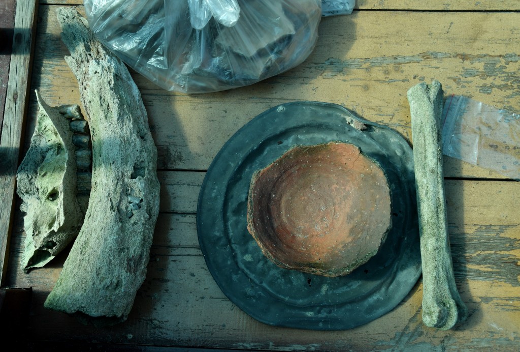 A photograph shows artefacts discovered by the expedition members at the underwater site on the bed of Lake Issyk-Kul of what is identified by researchers as a submerged medieval city on the Silk Road in the settlement of Toru-Aygyr in Kyrgyzstan on September 22, 2026. (AFP)