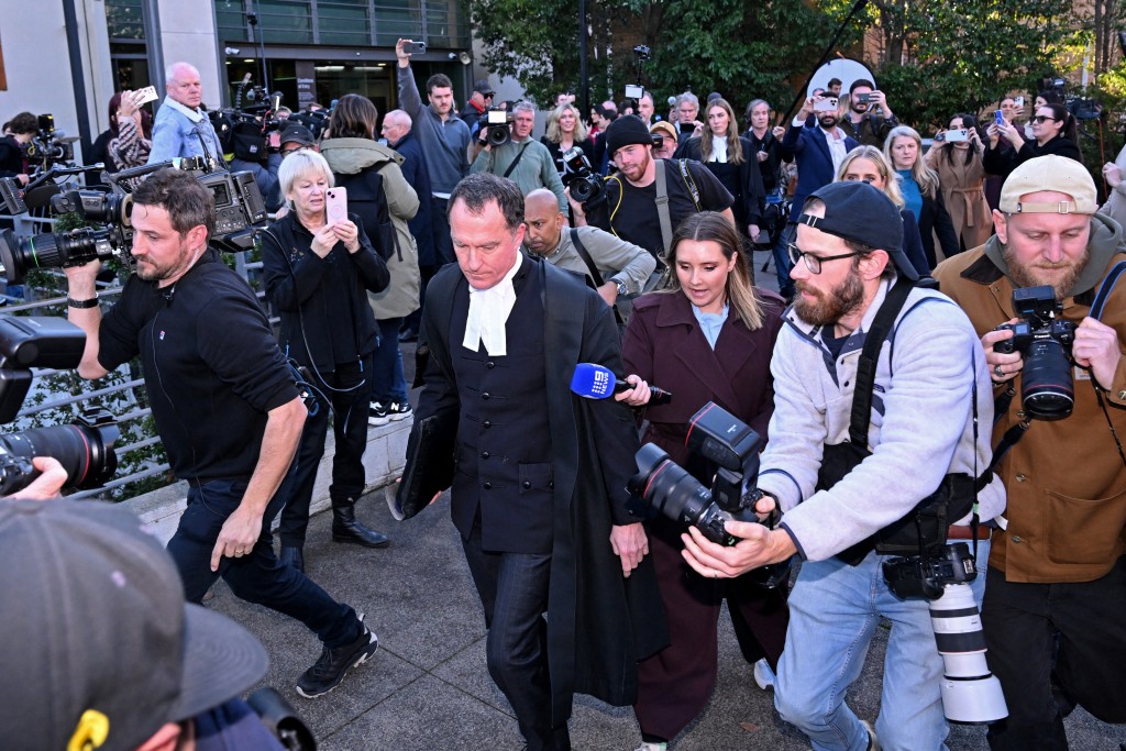  Lead barrister Colin Mandy (C) is surrounded by members of the media as he leaves the Latrobe Valley Magistrates' Court in Morwell on July 7, 2025. (AFP)