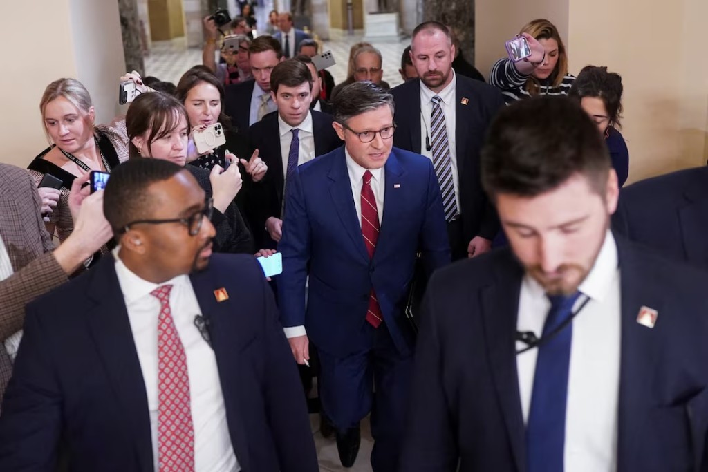 U.S. Speaker of the House Mike Johnson (R-LA) walks surrounded by the media, as members of the U.S. House of Representatives returned to Washington after a 53-day break, for a vote that could bring the longest U.S. government shutdown in history to a close, on Capitol Hill in Washington, D.C., U.S., November 12, 2025. REUTERS/Nathan Howard