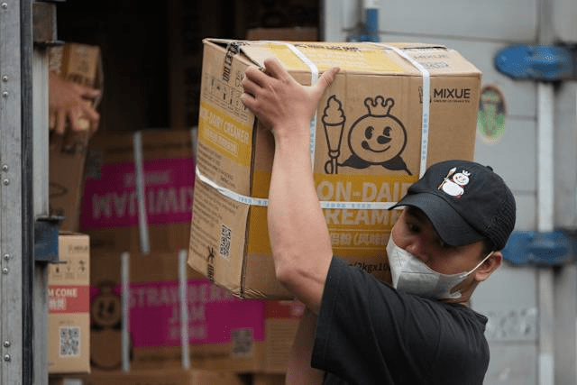 A worker carries a box of supplies for a Mixue store in Jakarta, Indonesia, Wednesday, Feb. 19, 2025. (AP Photo/Achmad Ibrahim) A worker carries a box of supplies for a Mixue store in Jakarta, Indonesia, Wednesday, Feb. 19, 2025. (AP Photo/Achmad Ibrahim)