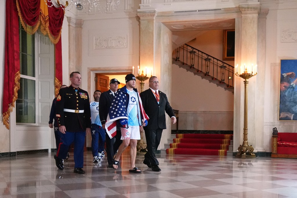 America's mixed martial artist Justin Gaethje walks through the Grand Foyer of the White House before his lightweight title bout with Georgia-Spain's mixed martial artist Ilia Topuria, during UFC Freedom 250 on the South Lawn of the White House, in Washington, DC, on June 15, 2026. (AFP)
