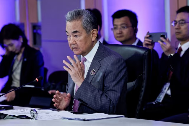 Chinese Foreign Minister Wang Yi speaks during the Opening Statement of the ASEAN Post-Ministerial Conference with China, at the Philippine International Convention Centre in Pasay City, Metro Manila, Philippines, July 22, 2026. ROLEX DELA PENA/Pool via REUTERS