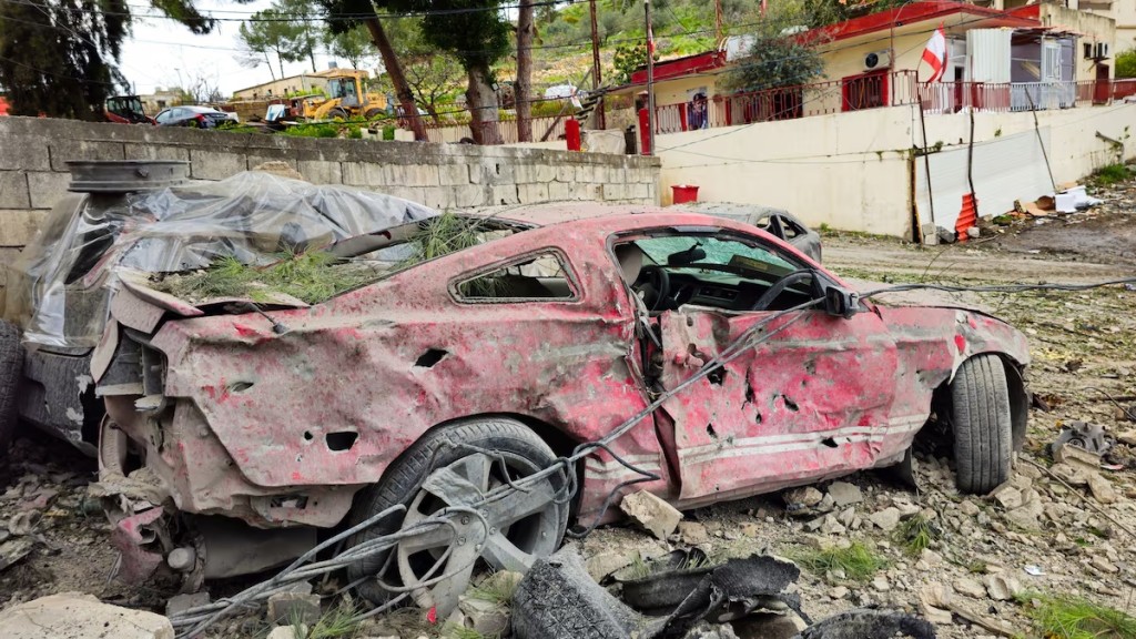 Damaged vehicles belonging to the Lebanese Civil Defence are seen after their headquarters was hit in an Israeli strike in the Nabatieh district, following an escalation between Hezbollah and Israel, amid the U.S.-Israeli conflict with Iran, southern Lebanon, March 18, 2026. Picture taken with a mobile phone. REUTERS/Mohamad Zanaty