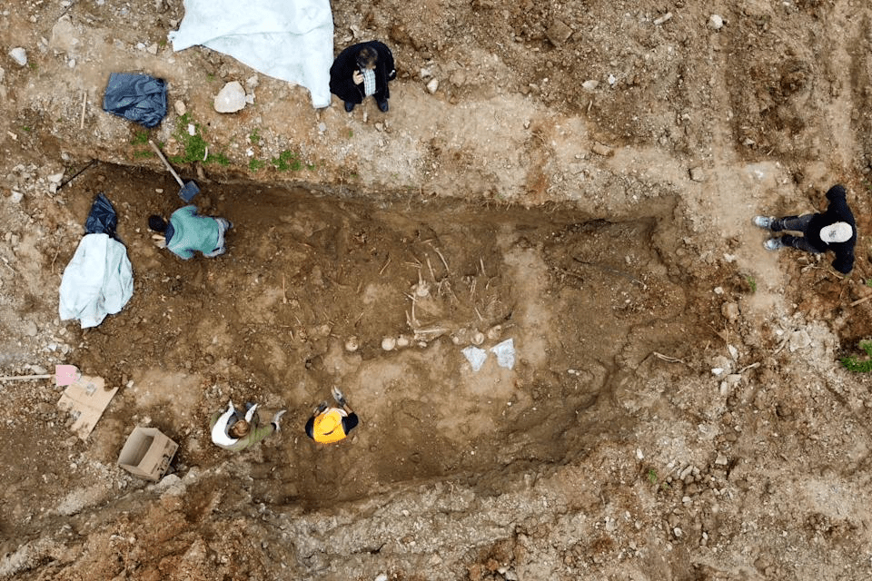 Construction crews uncover a mass grave in the city of Thessaloniki, Greece, on Feb. 28, 2025, containing remains believed to belong to dozens of prisoners executed during or after the Greek civil war. (Municipality of Neapoli-Sykies via AP)