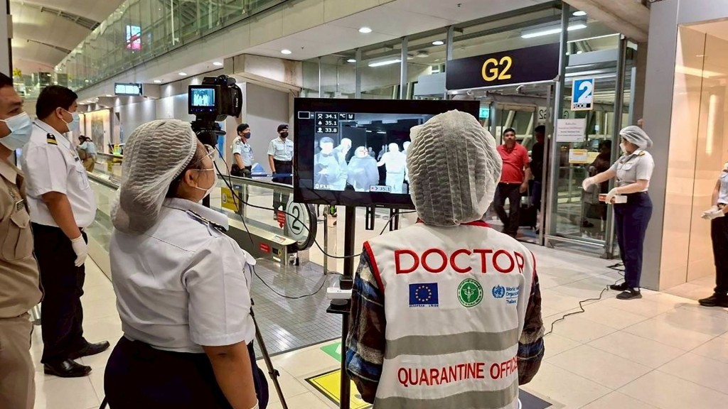 Airport health authorities monitor passengers from international flights arriving at Suvarnabhumi Airport in Bangkok. Reuters