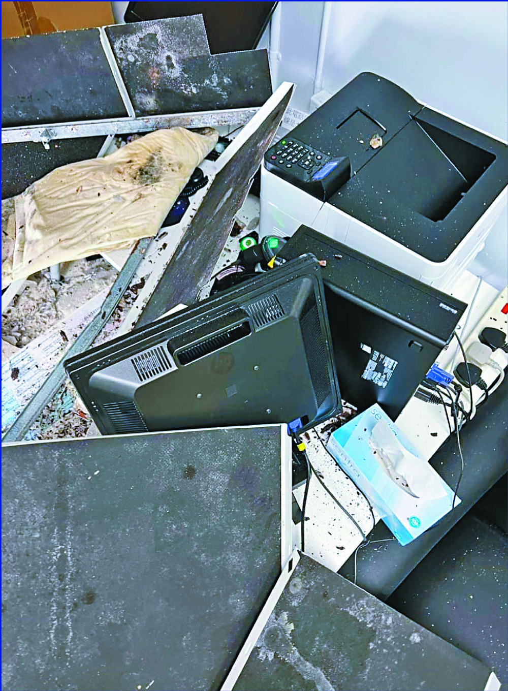 The concrete slabs that crashed into a computer and a printer in a consultation room at Kwai Chung Hospital marked the fifth reported mishap within a month. SING TAO The concrete slabs that crashed into a computer and a printer in a consultation room at Kwai Chung Hospital marked the fifth reported mishap within a month. SING TAO