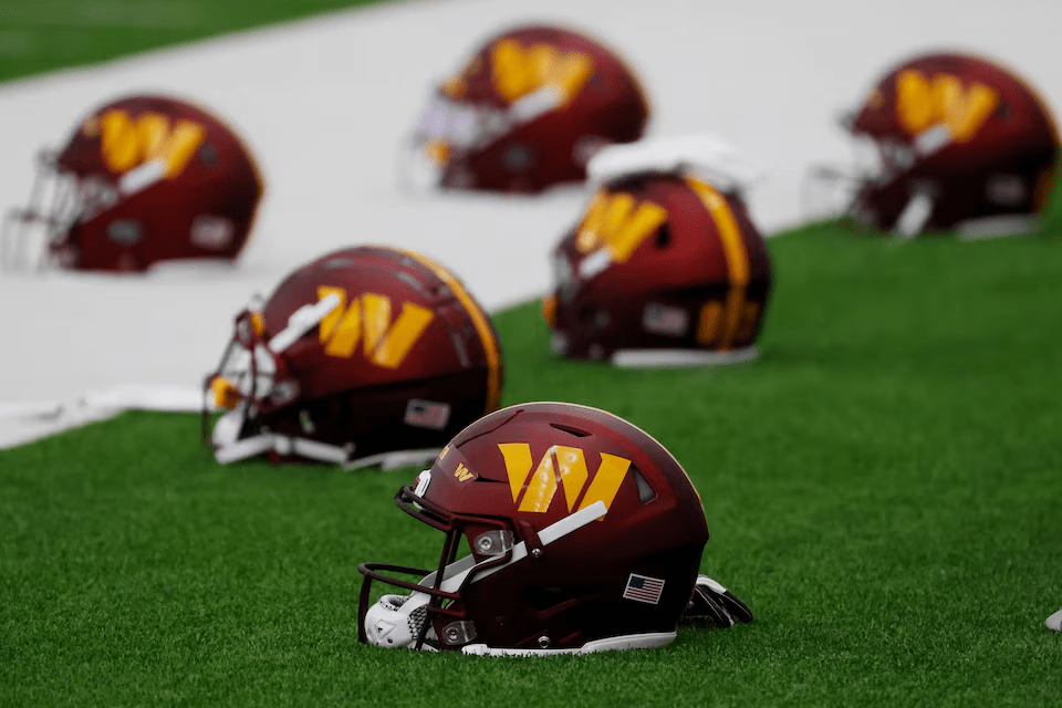  May 6, 2022; Ashburn, Virginia, USA; Washington Commanders players' helmets rest on the field during Washington Commanders rookie minicamp at Inova Performance Center In Ashburn, VA. Mandatory Credit: Geoff Burke-USA TODAY Sports/File Photo 