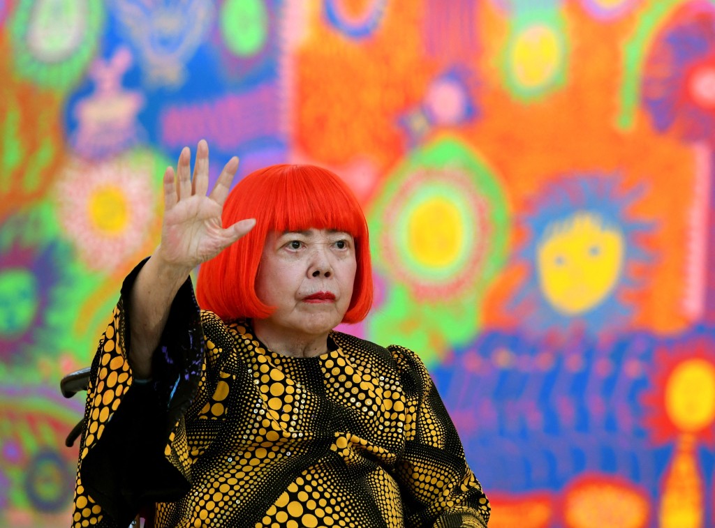 Japanese artist Yayoi Kusama waves at a photo session during a press preview of her exhibition titled 'My Eternal Soul' at the National Art Center in Tokyo on February 21, 2017. (AFP) Japanese artist Yayoi Kusama waves at a photo session during a press preview of her exhibition titled 'My Eternal Soul' at the National Art Center in Tokyo on February 21, 2017. (AFP)