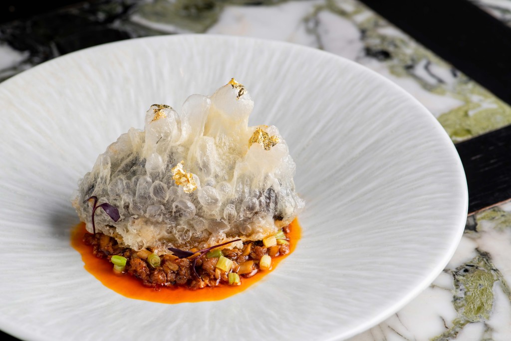 Braised sea cucumber stuffed with shrimp in mushroom sauce.