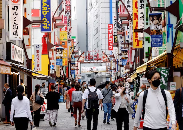 FILE PHOTO-People make their way at Ameyoko shopping district in Tokyo, Japan, May 20, 2022. REUTERS/Kim Kyung-Hoon/Files