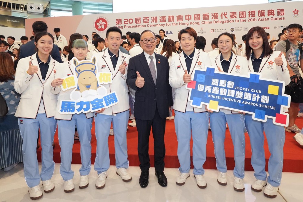 Hong Kong Jockey Club chairman Martin Liao Cheung-kong (center) poses for a photo with athletes.