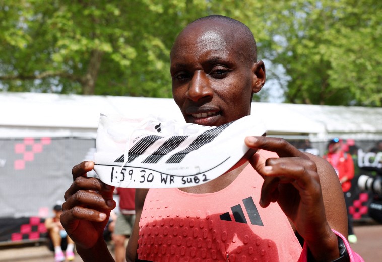 Sabastian Sawe celebrates with an Adidas Adizero Adios Pro Evo 3 shoe after his historic win at the London Marathon. REUTERS