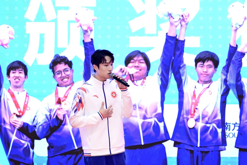 Fencer Ryan Choi performs a song at the ceremony.